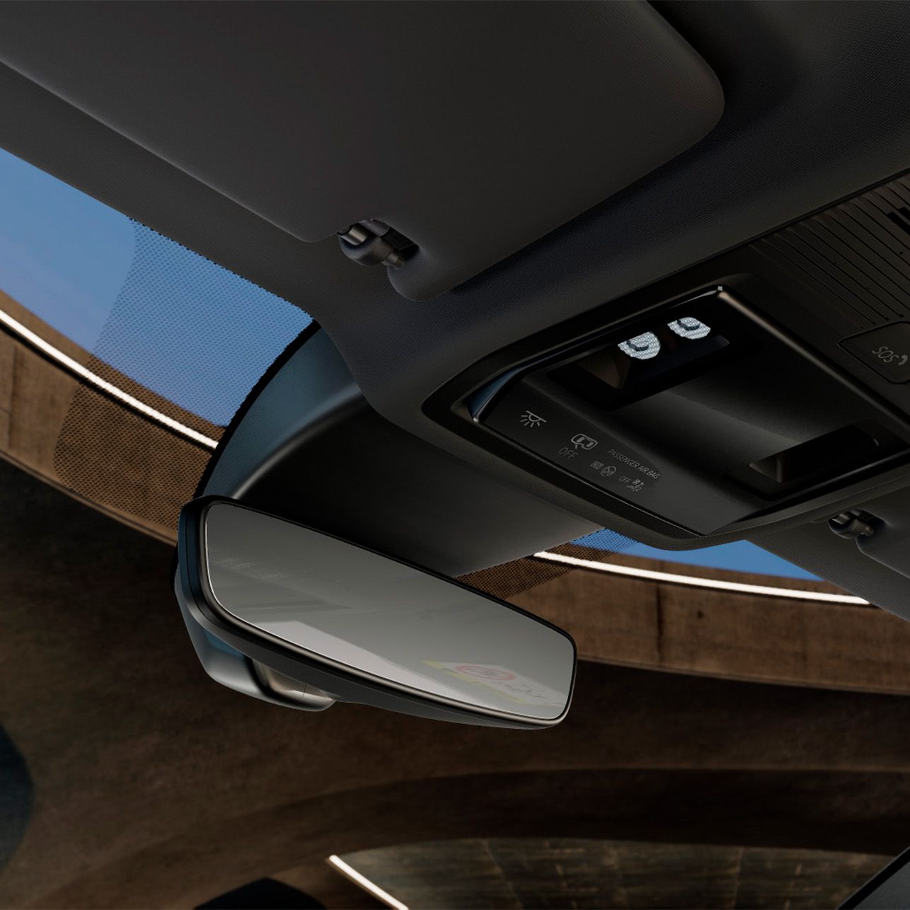 Notranjost avtomobila Cupra Leon z notranjim ogledalom in kontrolno plošča za luči na stropu. Na stropu je tudi nalepka z varnostnimi navodili.