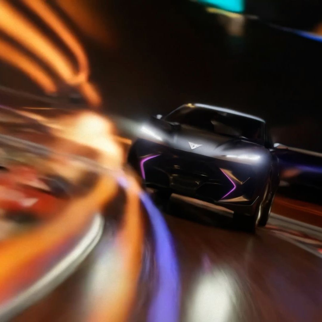 Pogled na vozilo CUPRA Tindaya od zunaj na sprednji del vozila. Okrog so žive barve, ki ustvarjajo svetlobne vzorce. Videti je, da vozilo drvi.